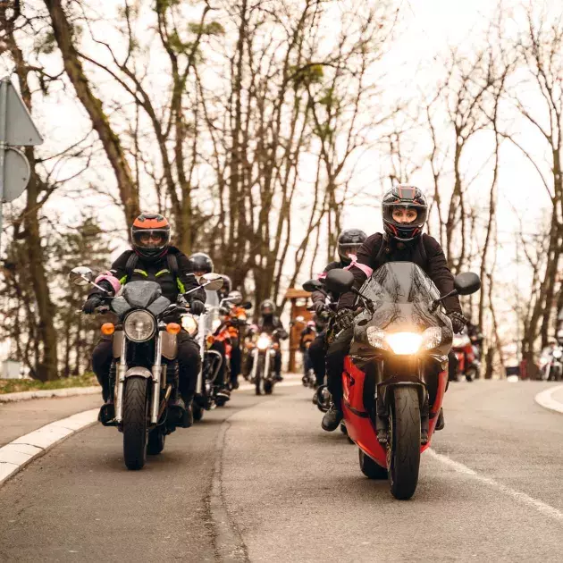 group motorcycle riding on the road